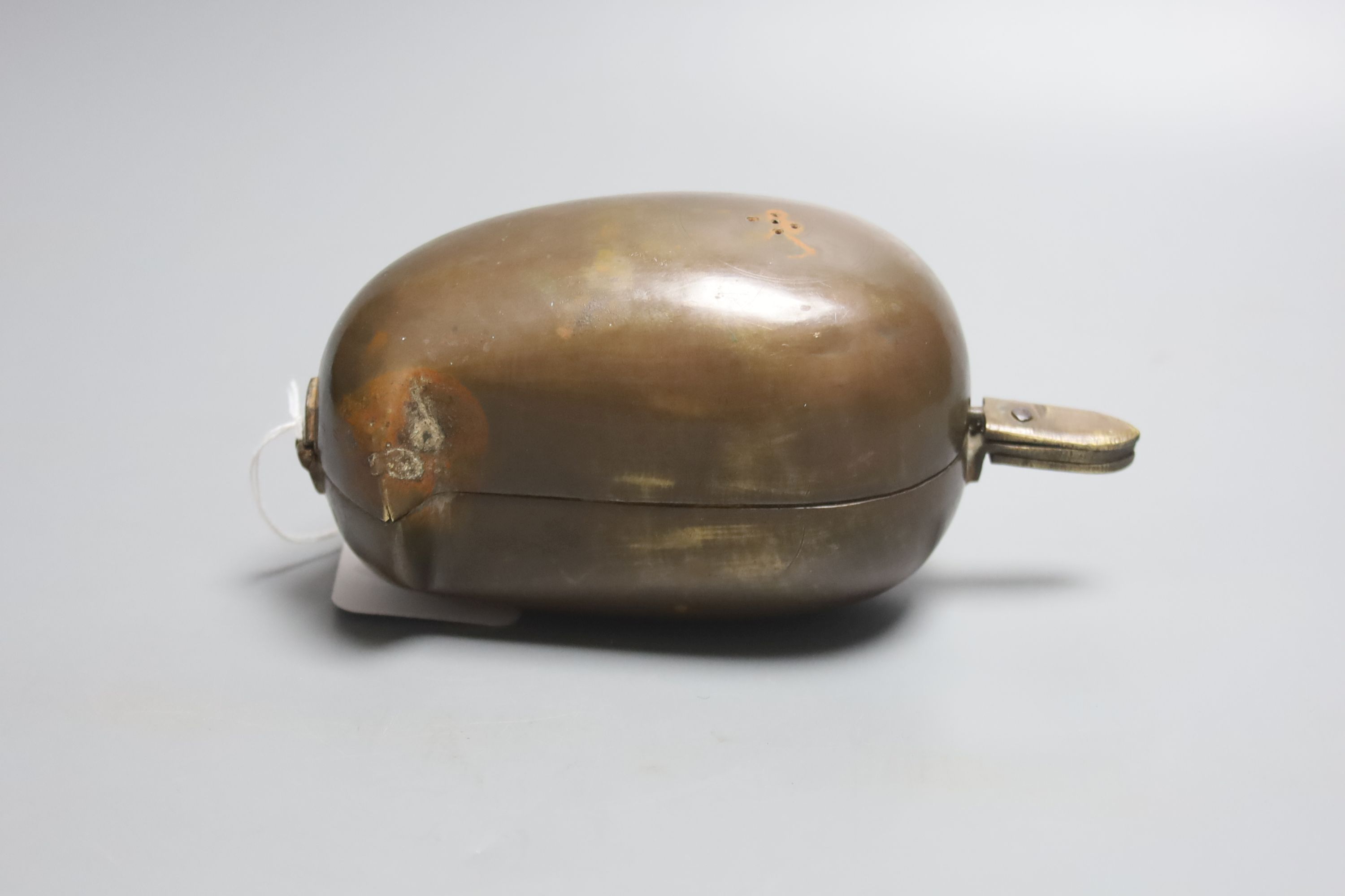 A late 19th / early 20th century Indian lidded brass spice box, tear shaped with a hinged cover revealing a divisional interior, 16cm l